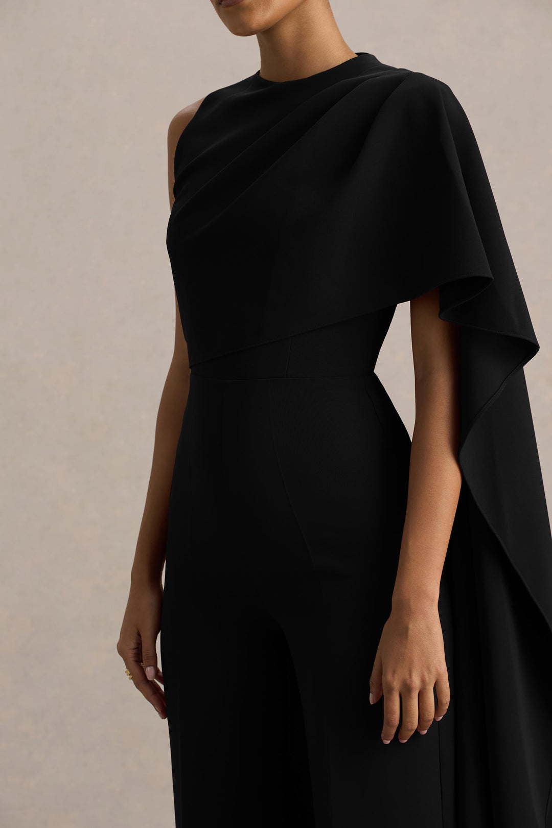 Sorenia | Black High-Neck Jumpsuit With One-Cape Sleeve